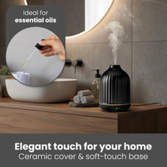MALMØ diffuser emitting a quiet mist for calm spaces.