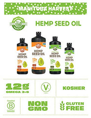 Manitoba Harvest hemp seed oil being poured over a fresh salad.