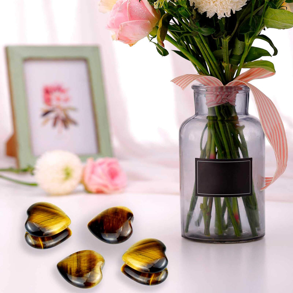 Marrywindix tiger eye heart stone used as a desk paperweight and decor.