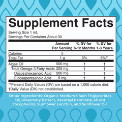 Infant omega-3 drops being poured into a spoon for small doses.