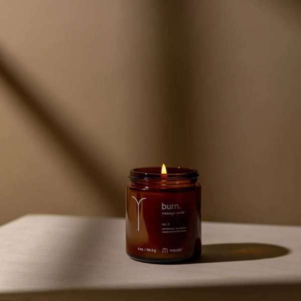 Maude Burn No. 3 melting wax highlights hydrating oil ready for skin application.