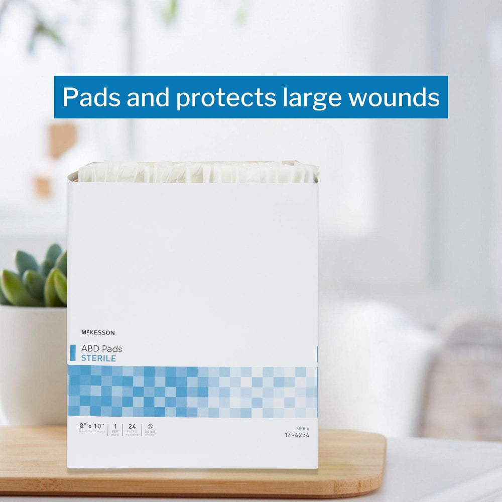 Clinical setting image highlights McKesson sterile abdominal pads in wound care routines.