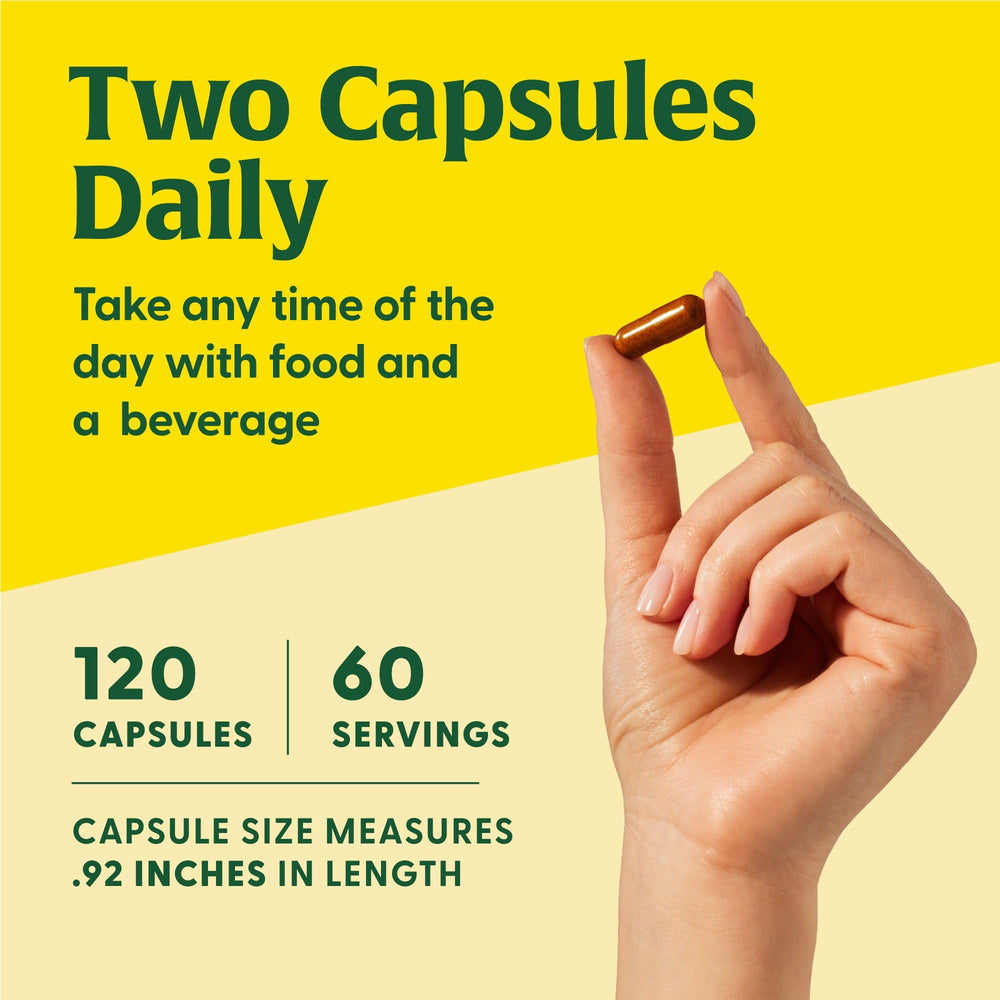 MegaFood Liposomal Vitamin C capsules being poured for convenient two-capsule serving
