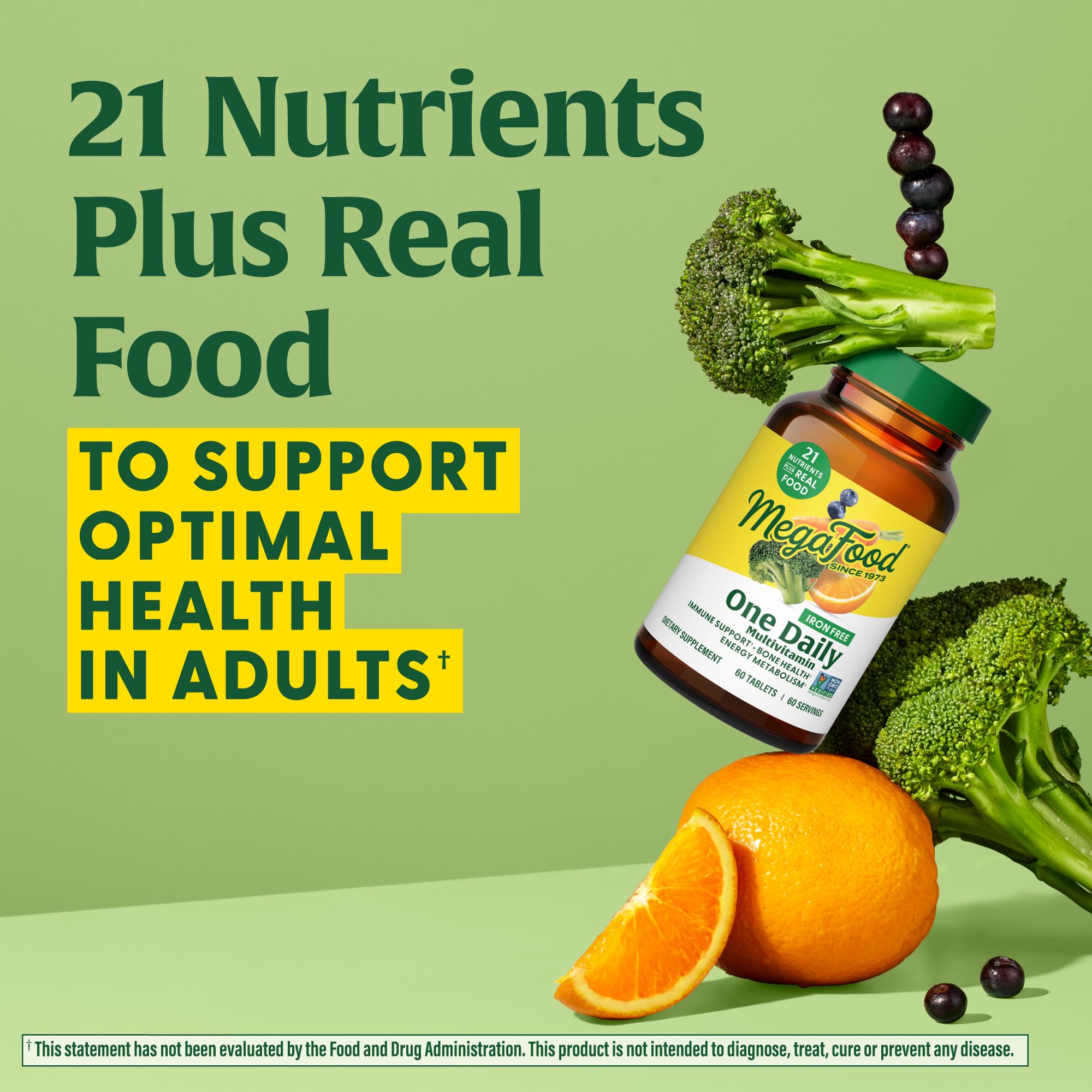 MegaFood One Daily Iron-Free Multivitamin packaging on table emphasizes eco-friendly real-food promise.