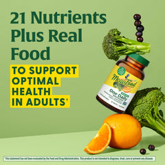 MegaFood One Daily Iron-Free Multivitamin packaging on table emphasizes eco-friendly real-food promise.