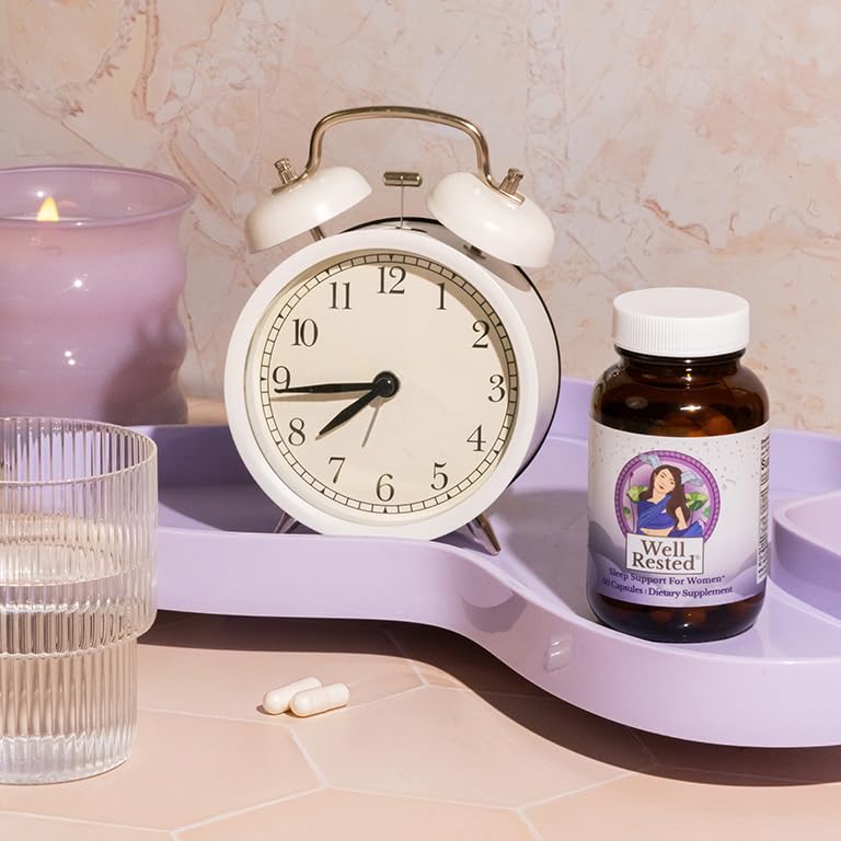 MENOLABS Well Rested capsules and glass ready for bedtime routine.