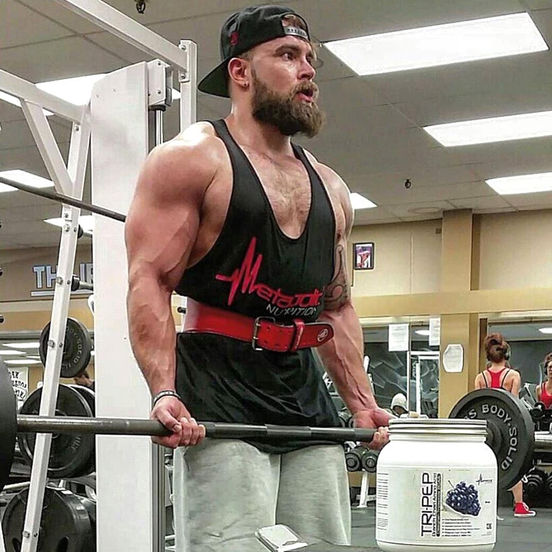 Gym scene with TriPep bottle promotes training-ready fueling.
