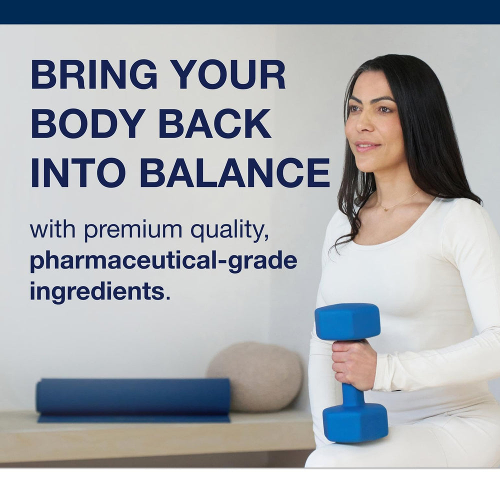 Hands holding Metagenics Intrinsi bottle, suggesting daily supplement routine.