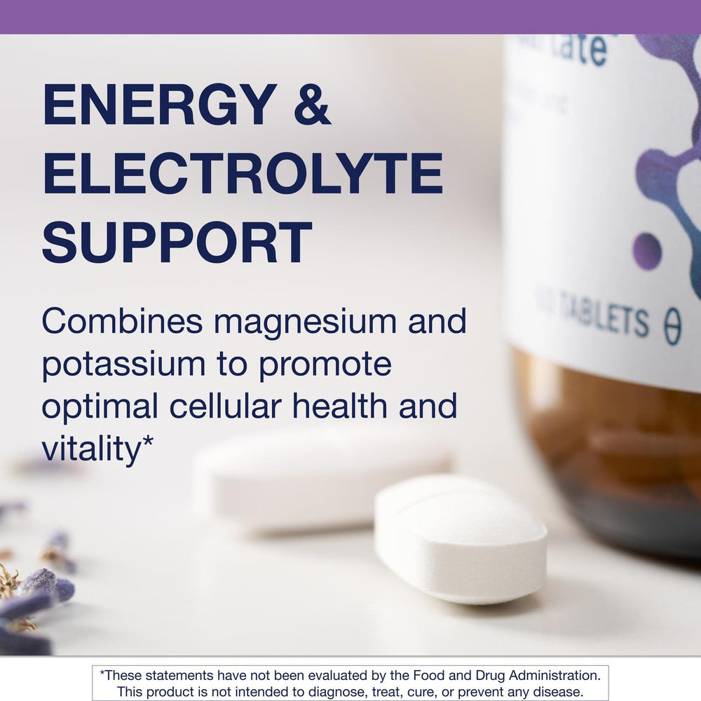 Metagenics Mg/K Aspartate tablet with water for workout recovery.