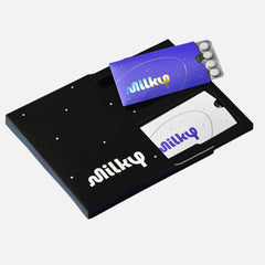 Milky lactose pills packaging front with discreet travel sleeves for on-the-go relief.