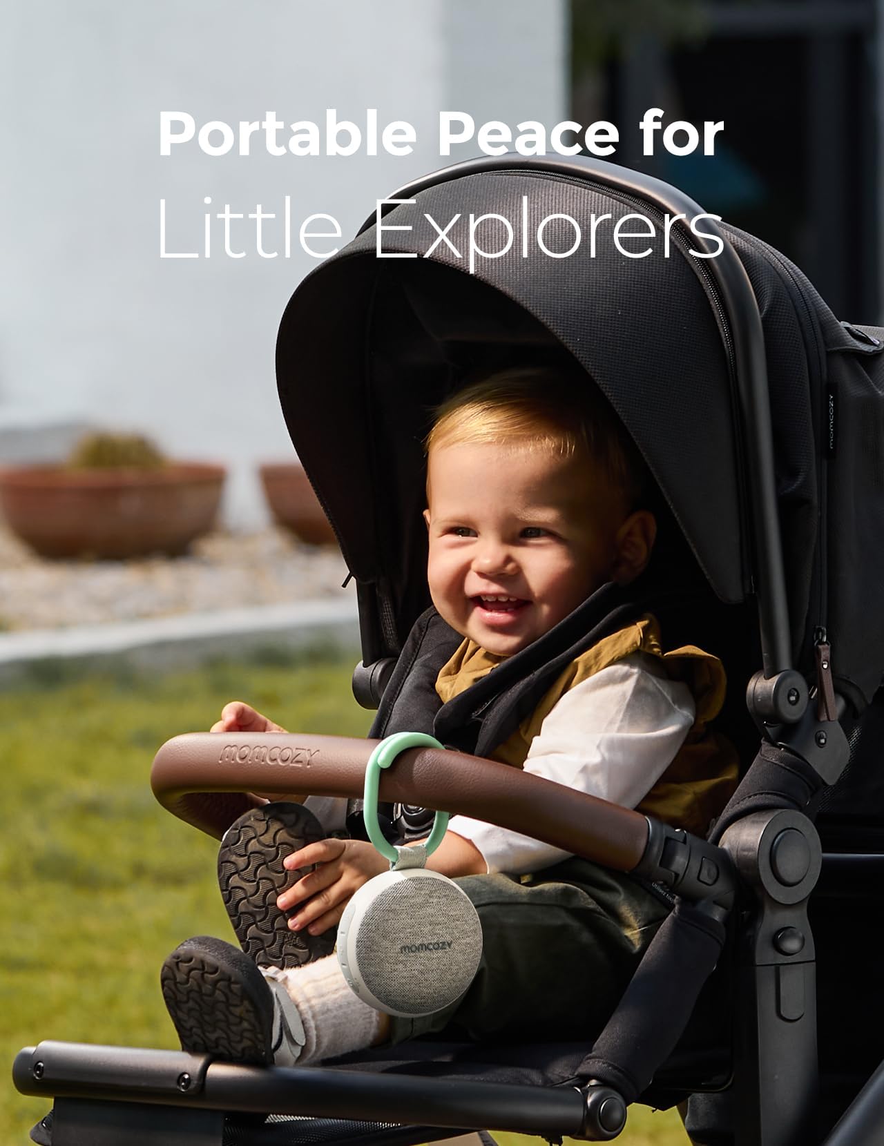 Momcozy clip-on stroller mount keeping soothing sounds within reach