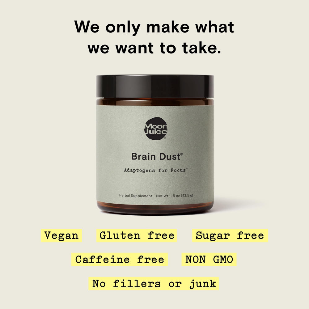 Moon Juice Brain Dust ingredients spread featuring Lion's Mane and adaptogens for clarity.