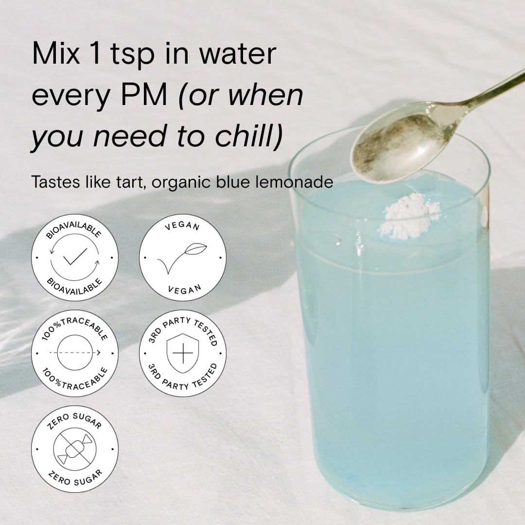 Moon Juice Magnesi-Om Blue Lemon Stick dissolving quickly in a glass.