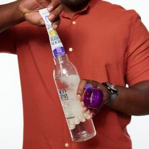 Moonstone Stone Stopper Tropical bottle beside glass ready for daily routine