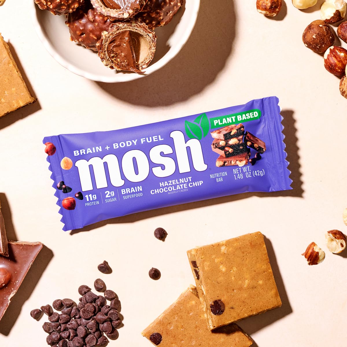 MOSH bar beside glass of water suggests balanced brain-friendly snacking