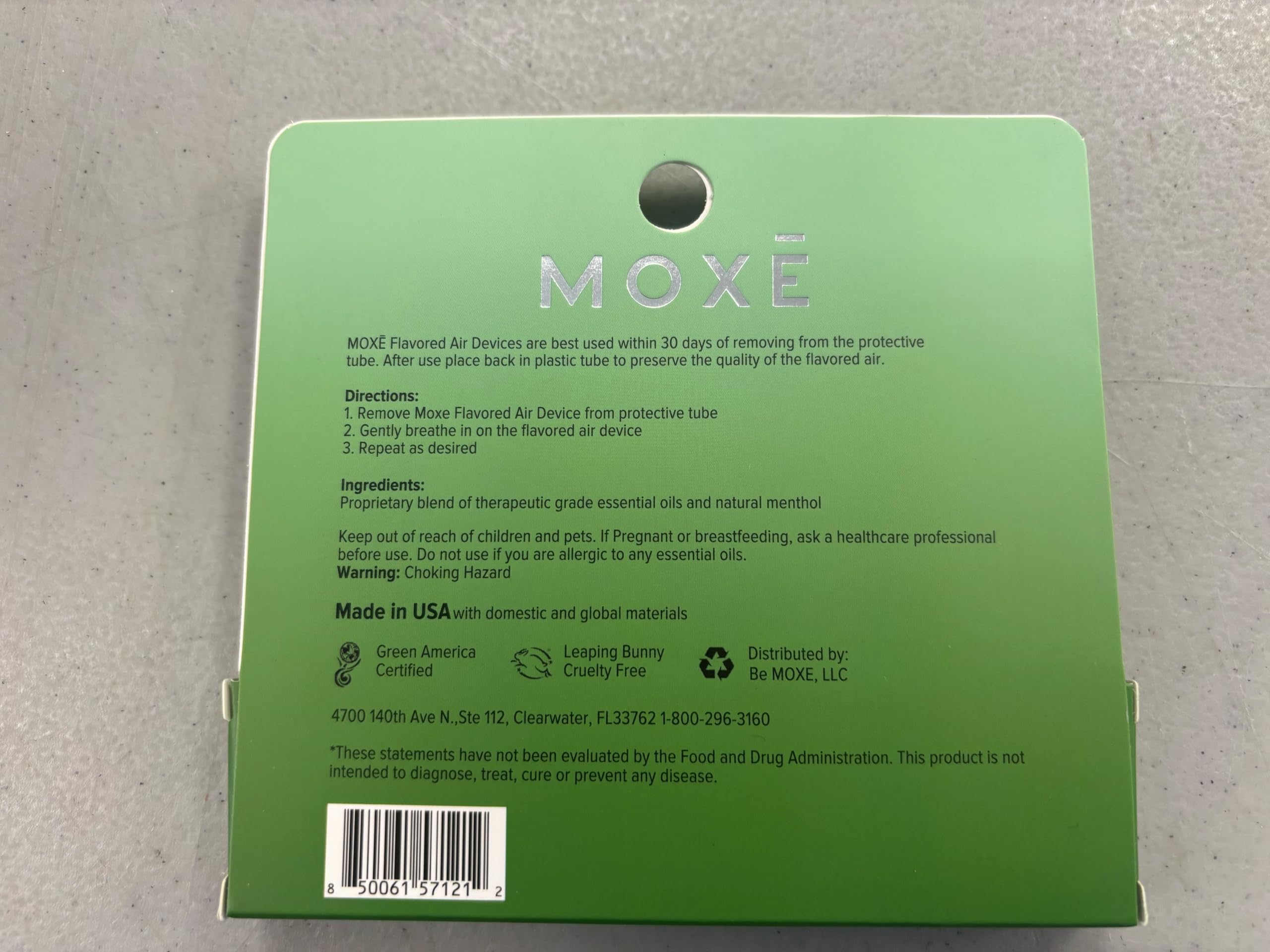 MOXE spearmint air inhaler usage close-up demonstrates easy, portable aroma delivery.