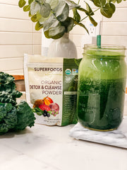 MRM Detox mixed into a glass creates a vibrant peach mango beverage
