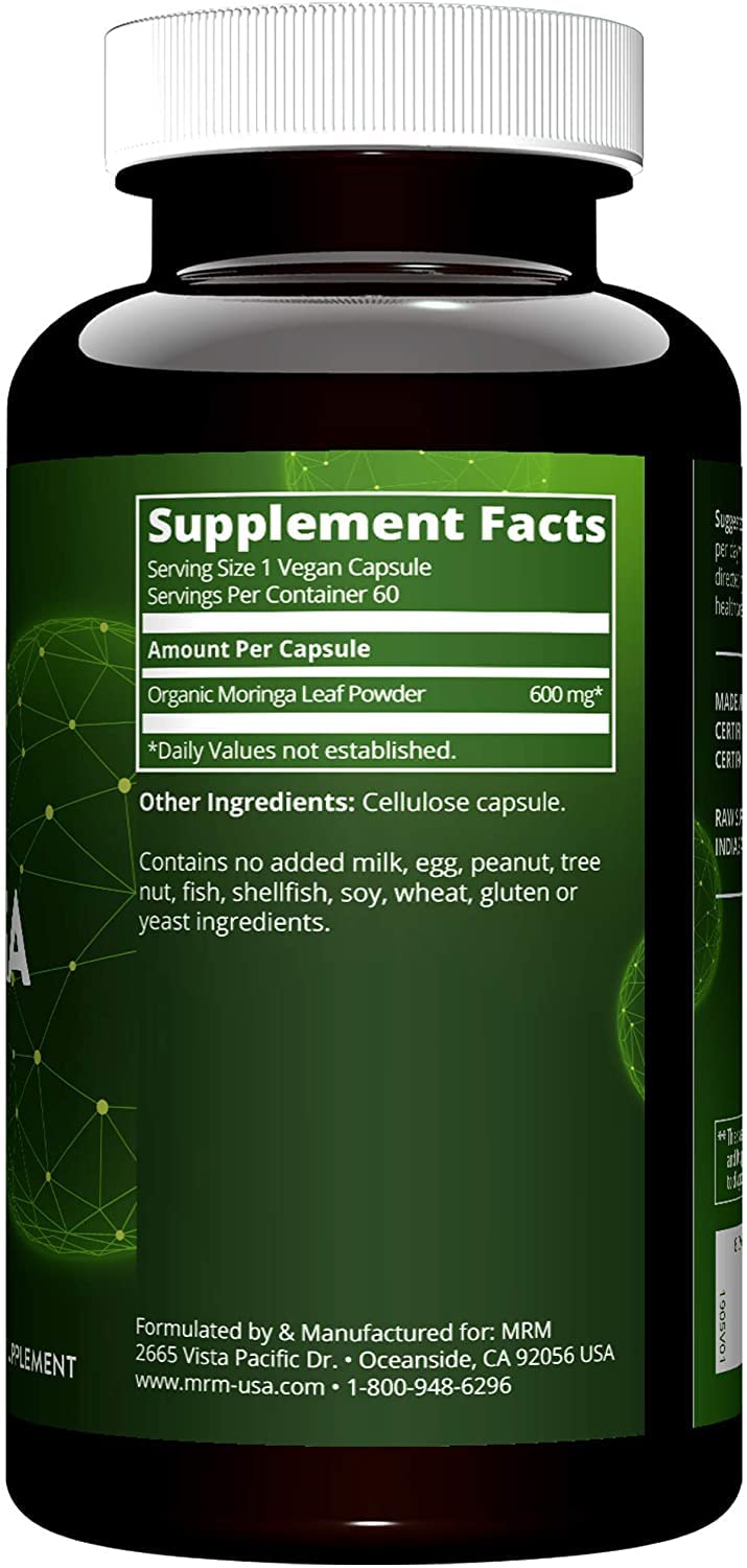 MRM Moringa Leaf Capsules in hand, showcasing convenient vegan supplement