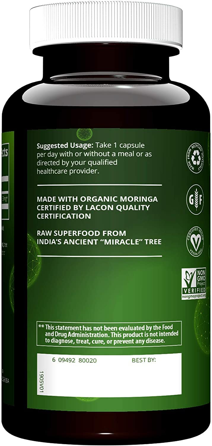 MRM Moringa Leaf Capsules close-up with moringa leaves for natural nutrition