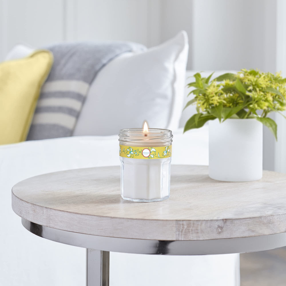 Candle shown in a cozy living space for relaxation and chores.