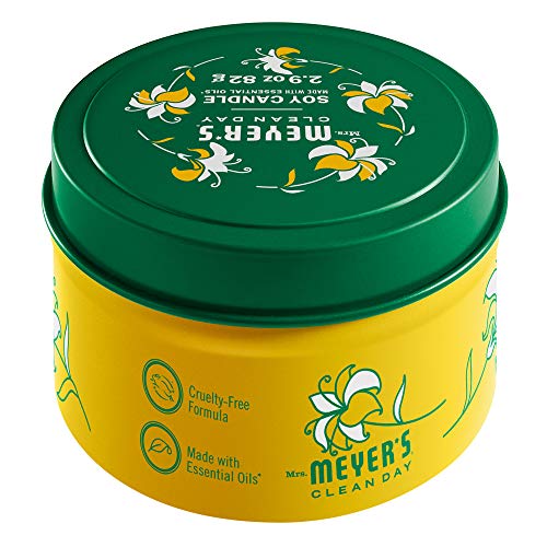 Close-up of Honeysuckle tin candle by Mrs. Meyer’s with scent notes