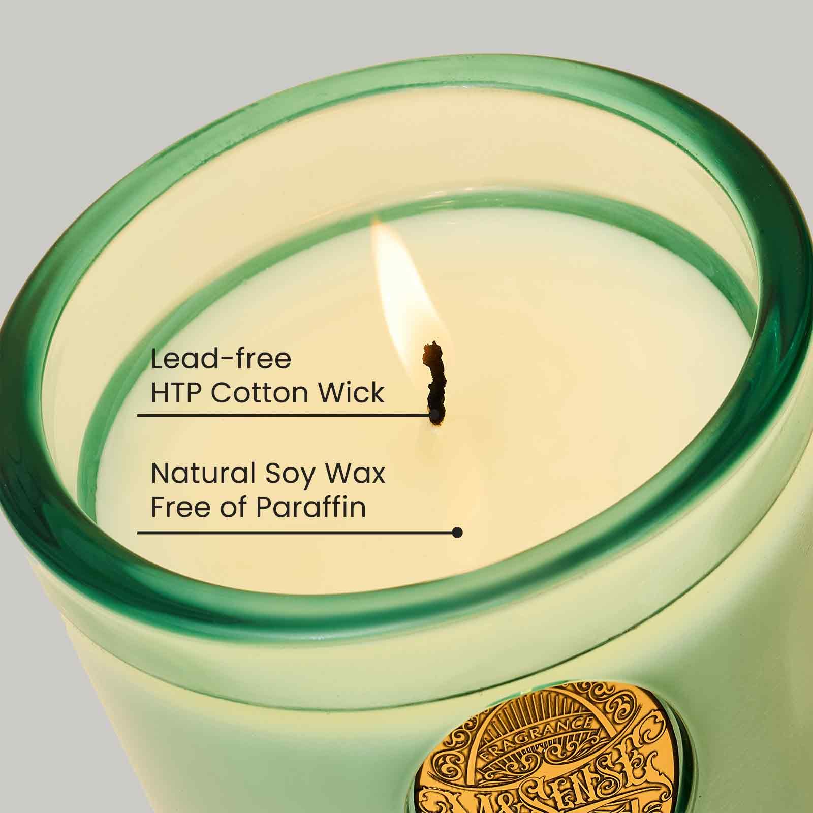 MSENSE eucalyptus mint candle in blue jar enhances bedroom ambiance.