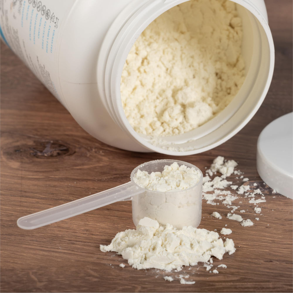 Mt. Capra Clean Whey tub beside a smoothie glass promotes daily protein