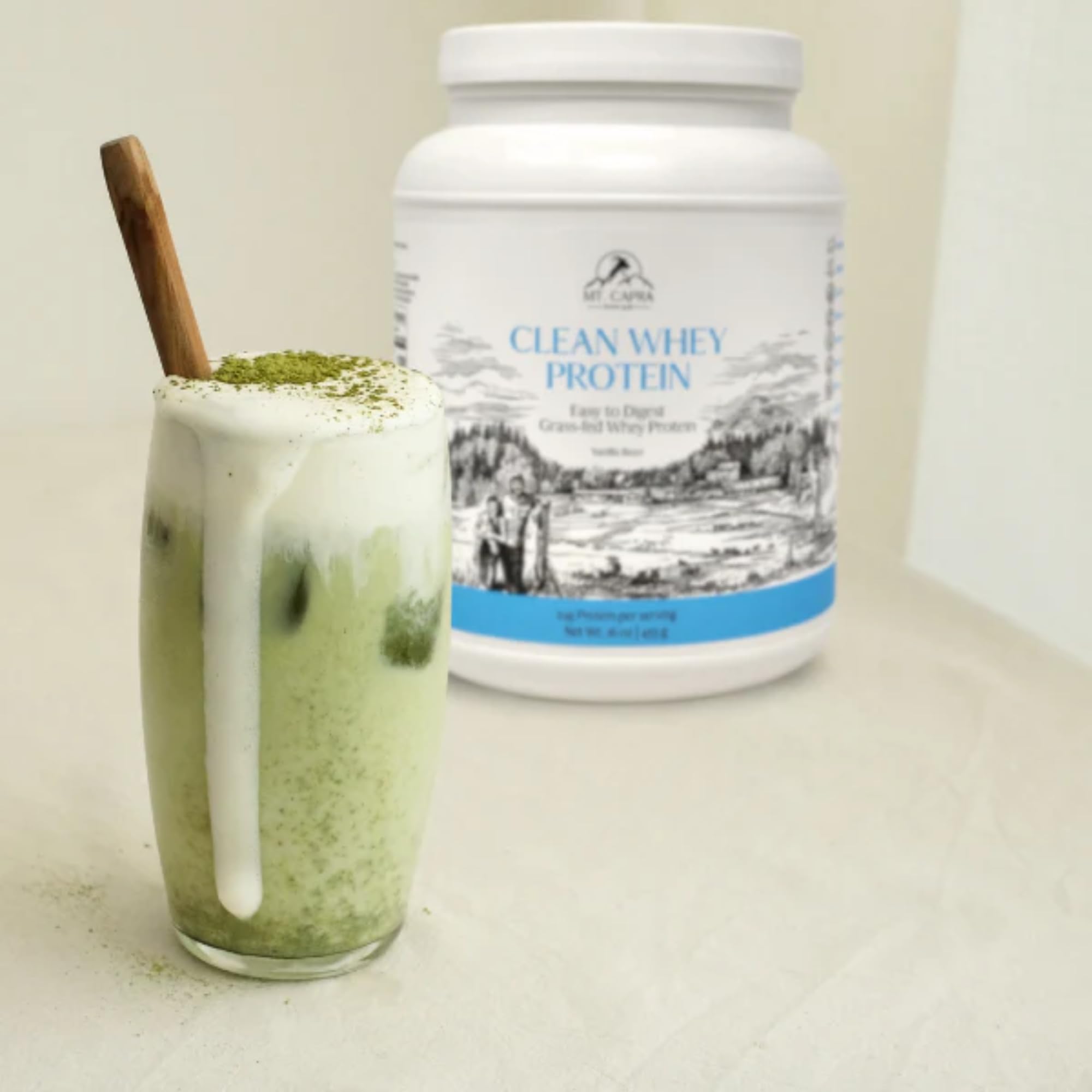 Mt. Capra Vanilla bottle with measuring scoop for on-the-go protein