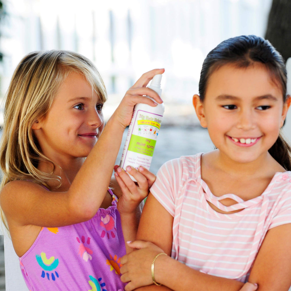 MY HAIR HELPERS Mint Lice Prevention Spray applied to hair for routine use