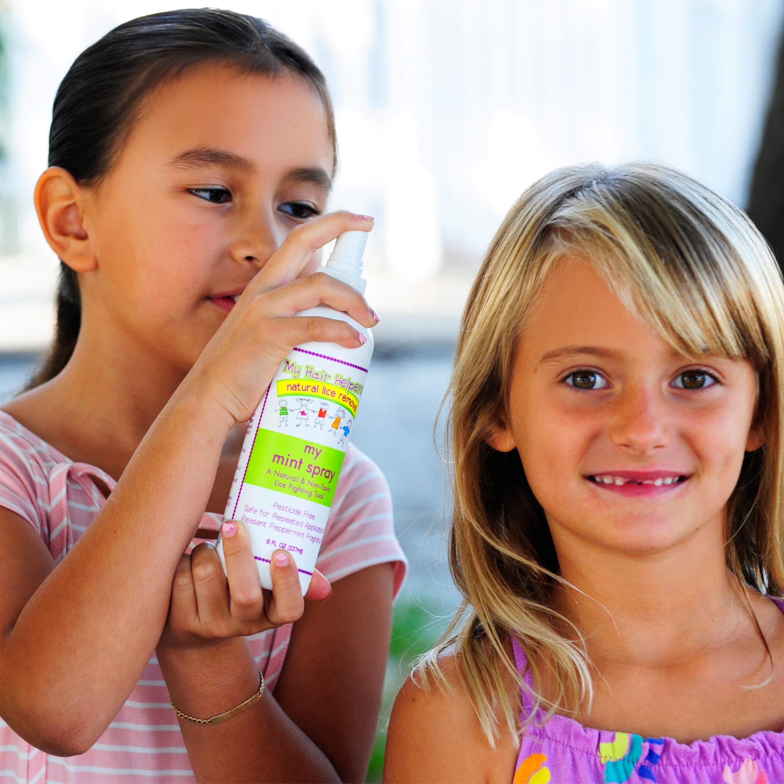 8 oz MY HAIR HELPERS Mint Lice Prevention Spray placed in a school backpack