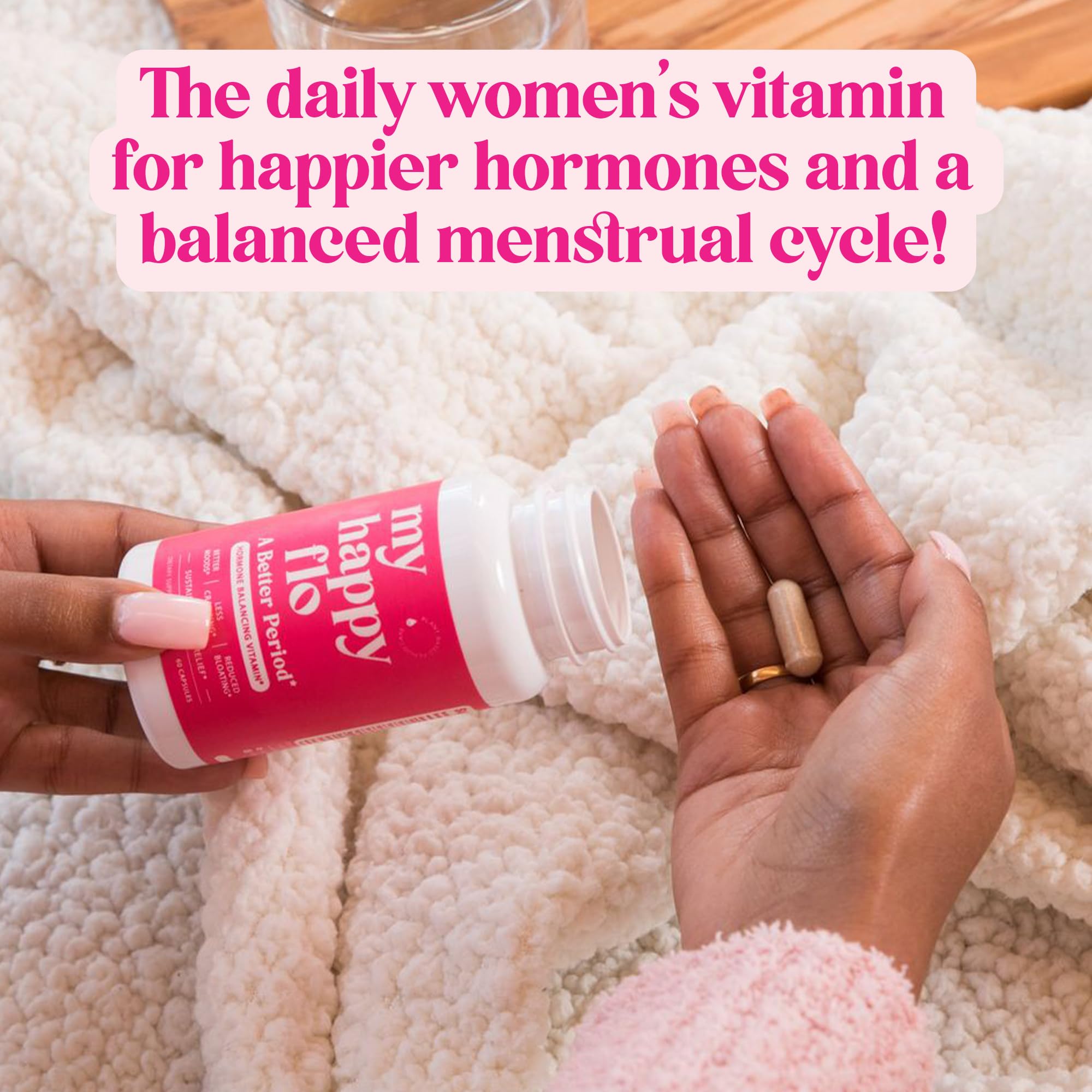 Close-up of iron and essential vitamins with My Happy Flo bottle.