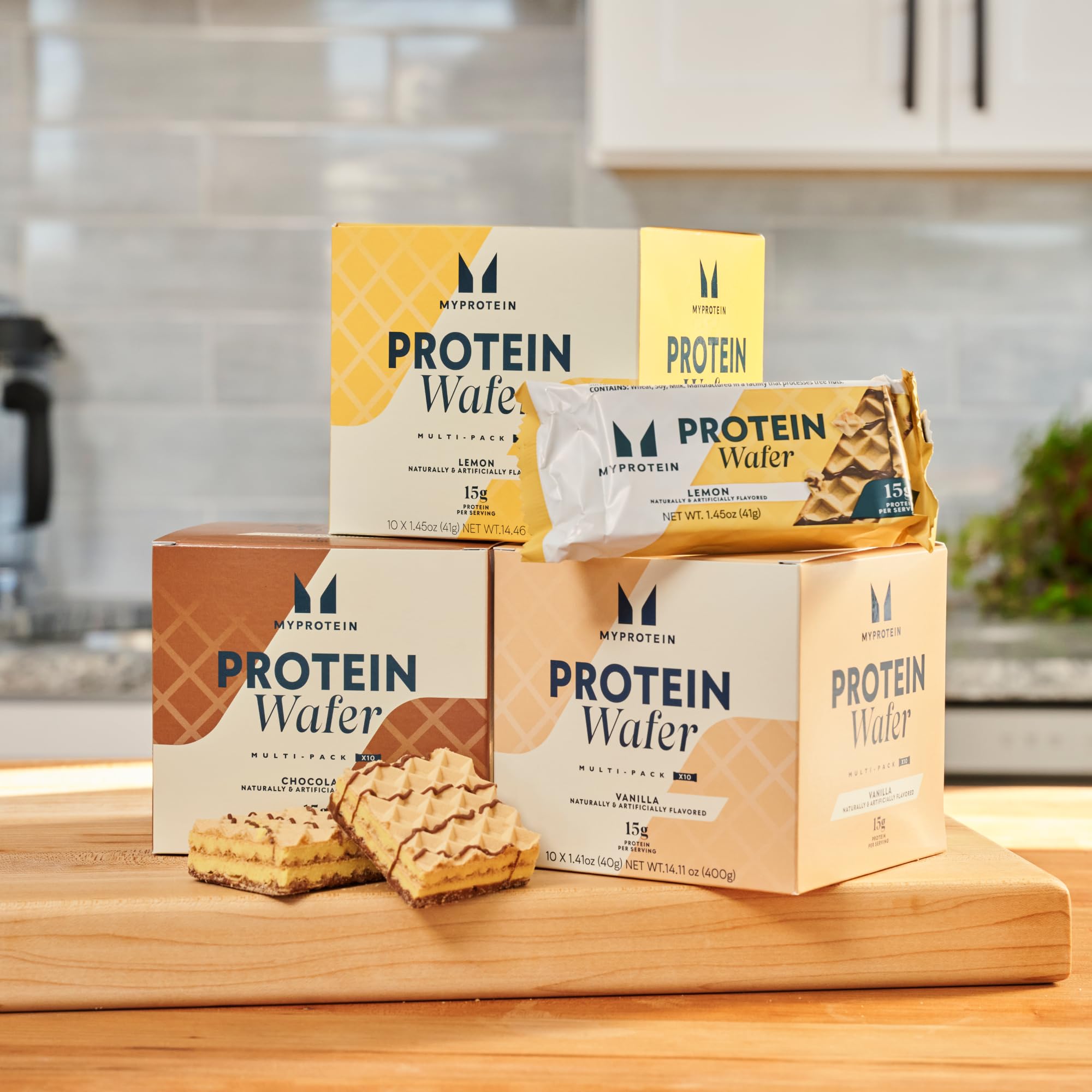 Myprotein Protein Bars in hand demonstrate portable high-protein nutrition during workouts