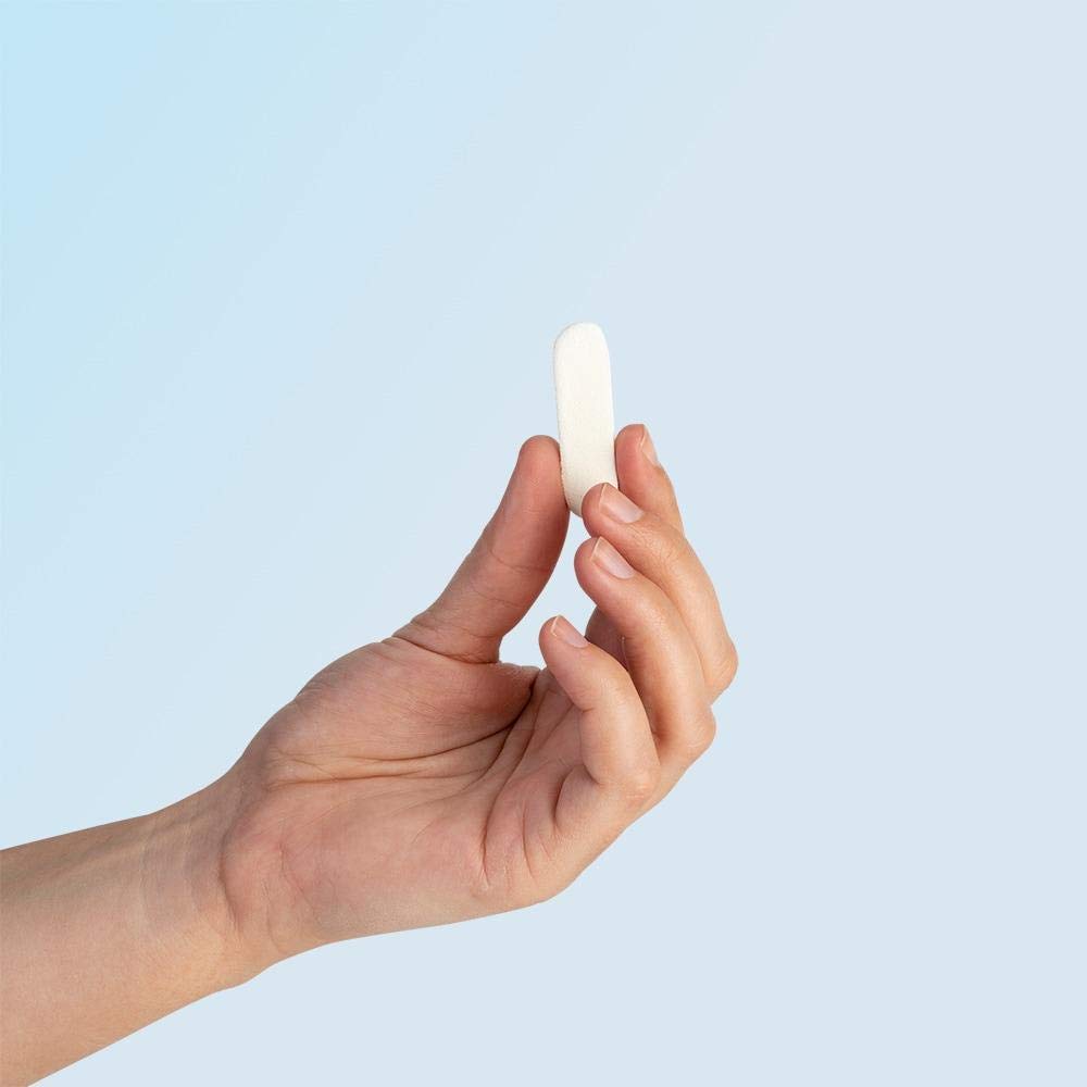 Nampons nasal plug in use during a nosebleed, gentle insertion.