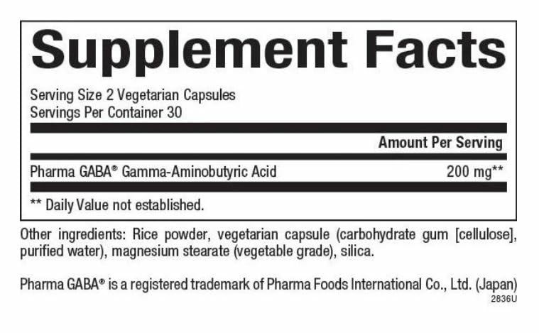 Study-focused person taking PharmaGABA for sustained cognitive support.