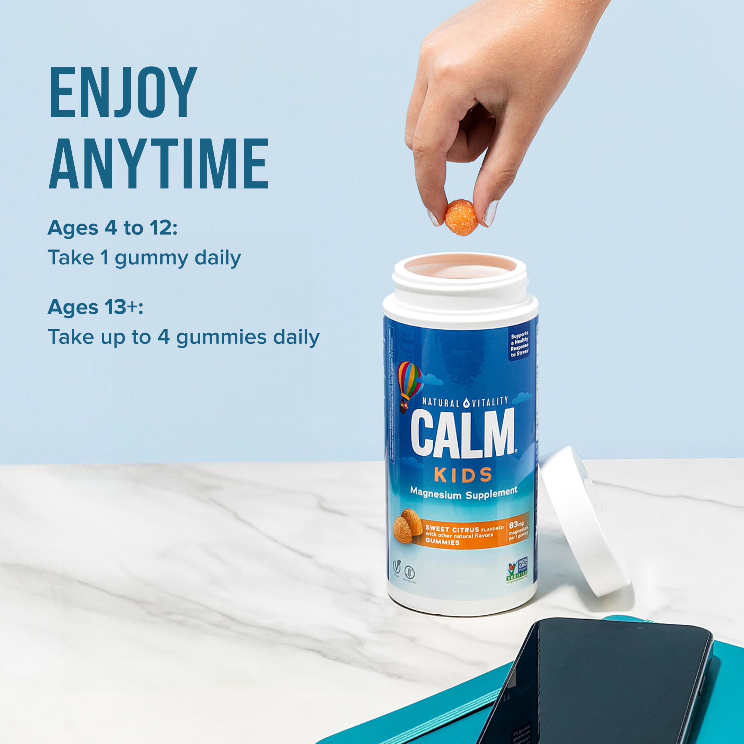 Natural Vitality CALM Kids gummies on surface, ready for after-school snack.