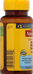 Nature Made B-12 softgel being taken for daily energy support.
