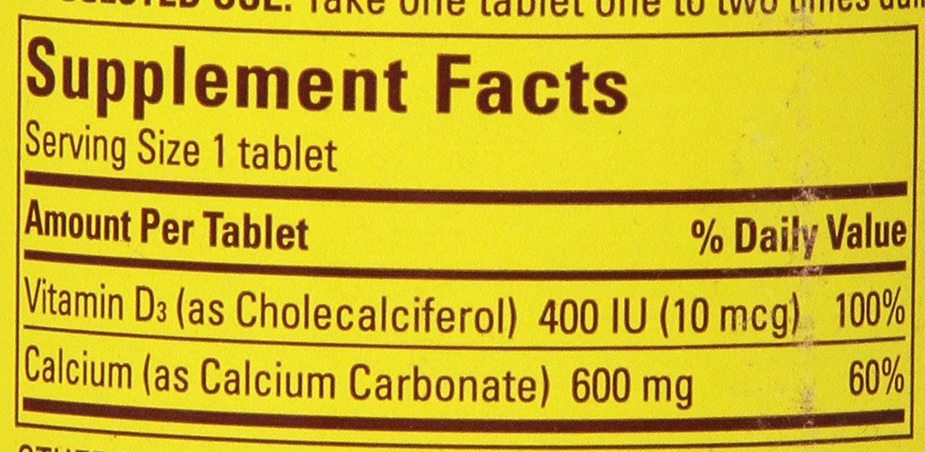 Pack of three Nature Made Calcium 600 mg with Vitamin D3 bottles on shelf.