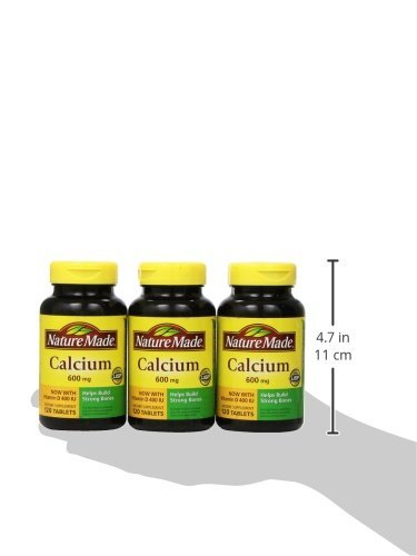 Nature Made Calcium 600 mg with Vitamin D3 tablet shown with water and meal.