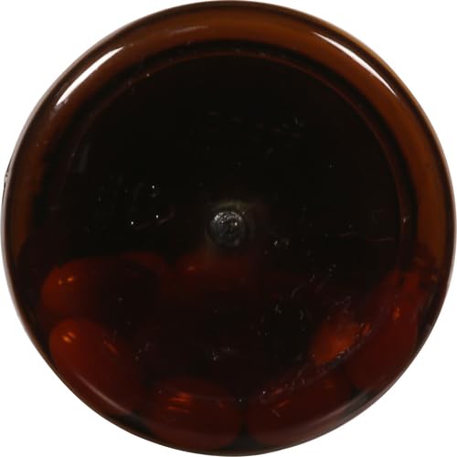 Nature Made CoQ10 bottle with glass and morning light