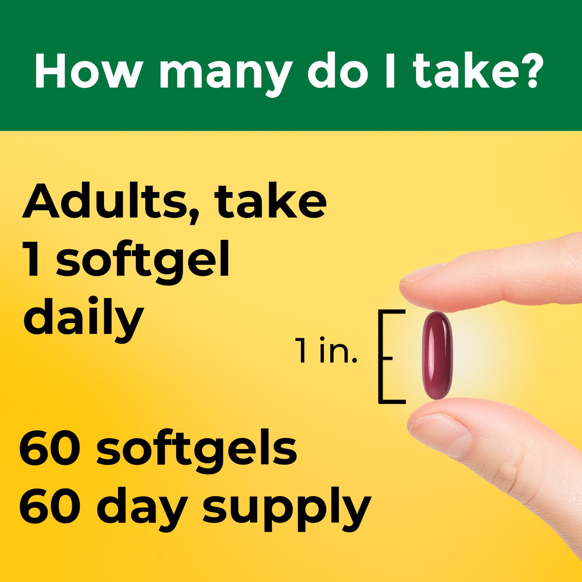 Nature Made magnesium oxide softgels in hand, ready to take with water.
