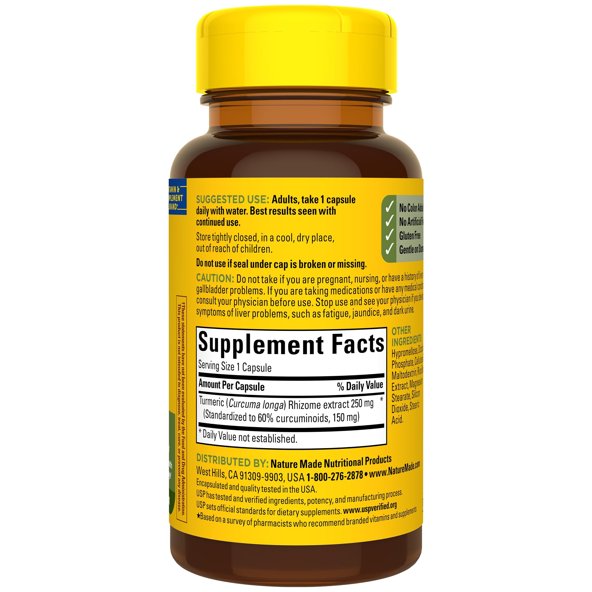 Nature Made Turmeric Curcumin capsules on countertop with glass of water