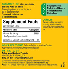 Close-up of Nature Made Vitamin B-6 100 mg tablets for daily energy.