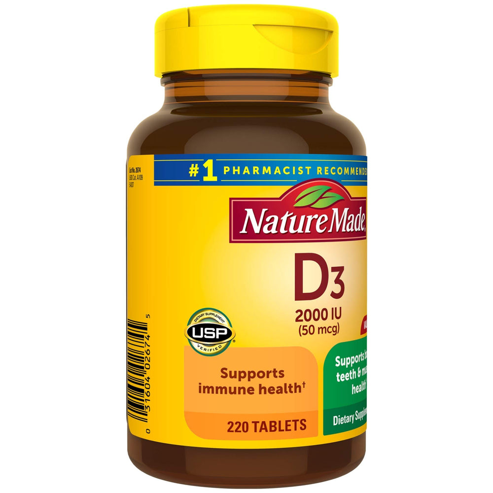 Nature Made Vitamin D3 bottle pictured beside a glass of water.