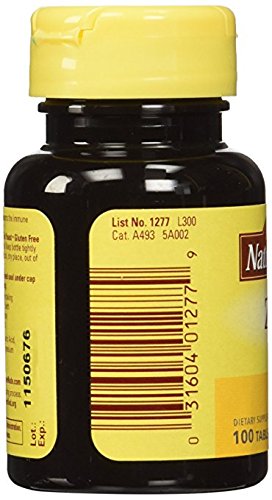 Nature Made Zinc 30 mg, persona tomando tableta con agua, uso diario.