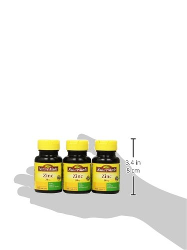 Zinc 30mg bottle among vitamins, supports overall wellness.