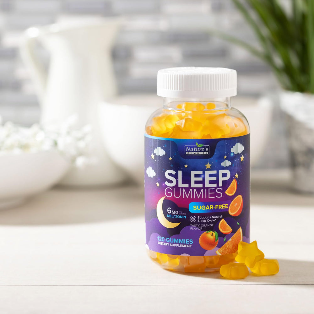 Glass of water beside Nature's Gummies Sleep gummies for easy swallowing.