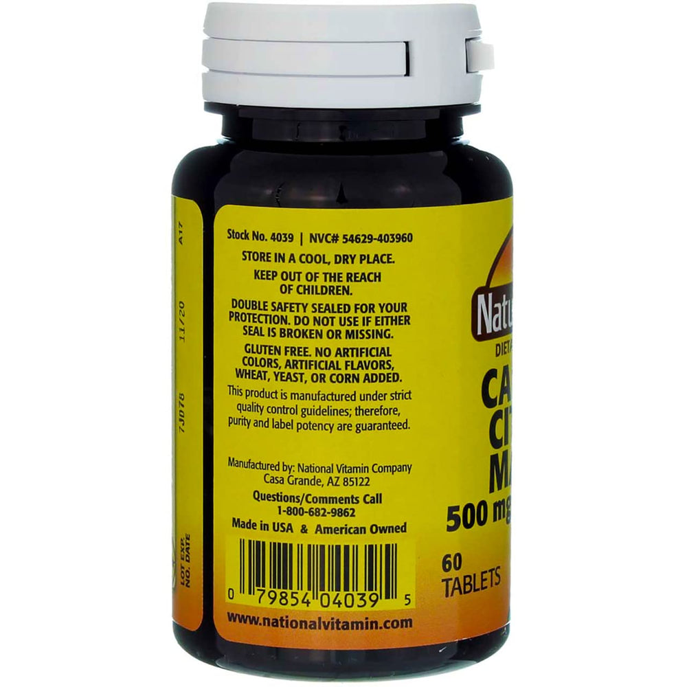 Close-up of calcium citrate malate tablets showing unflavored format