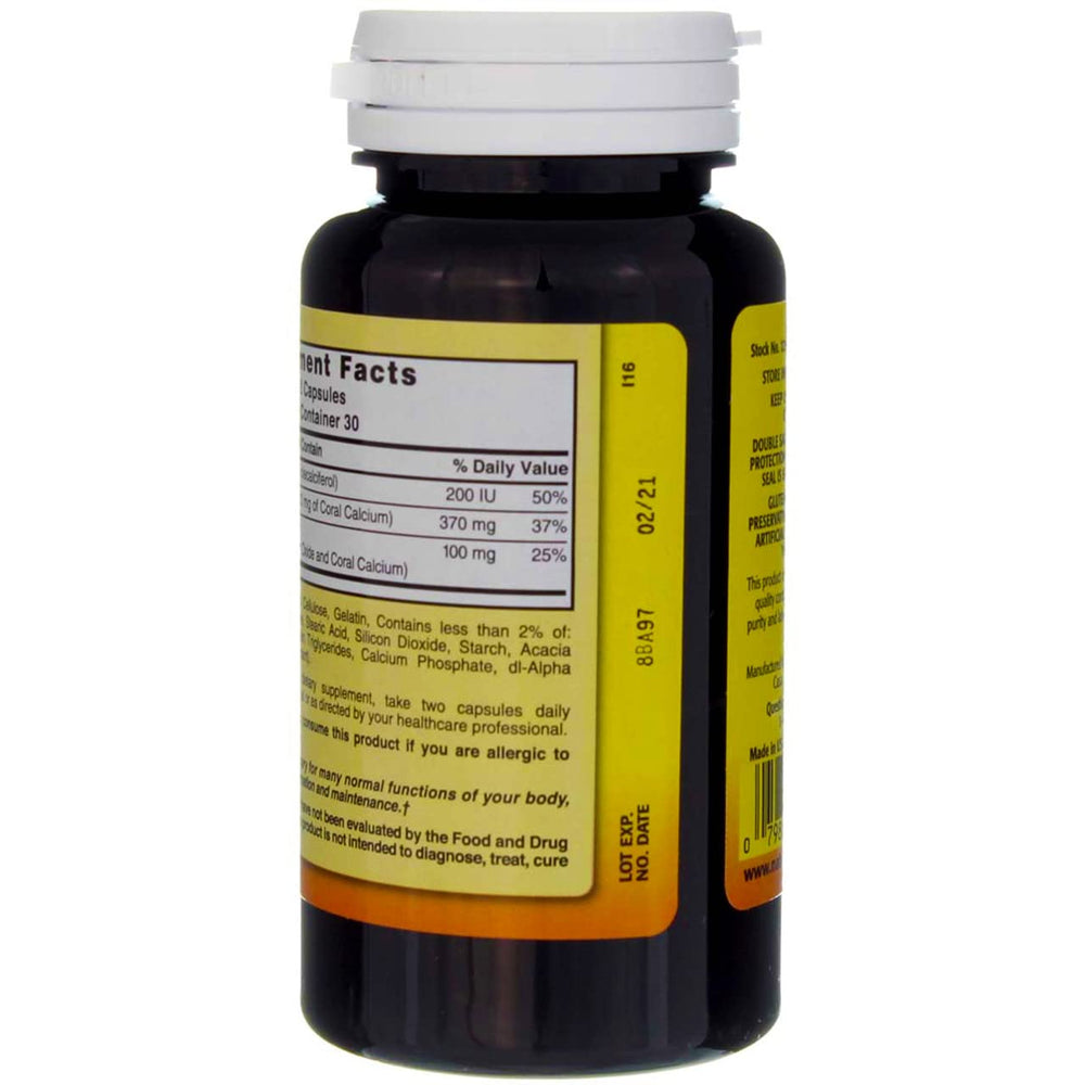 Nature's Blend coral calcium capsules with a glass of water for daily use