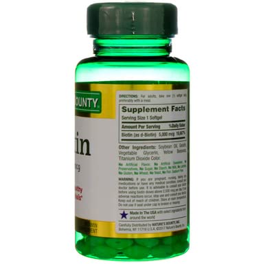 Nature's Bounty Biotin 5000mcg bottle pour showing dosing capsules
