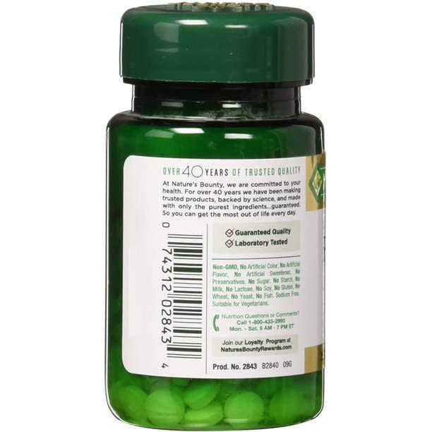 Close-up of Nature's Bounty folic acid 800 mcg tablet showing compact form.
